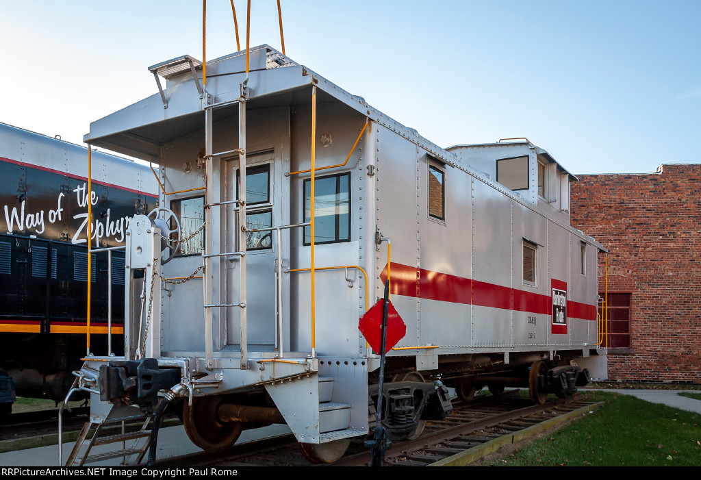 CBQ 13555 wearing fresh paint and lettered for CB&Q this ex EJ&E caboose is on display at the Monroe County Historical Society 